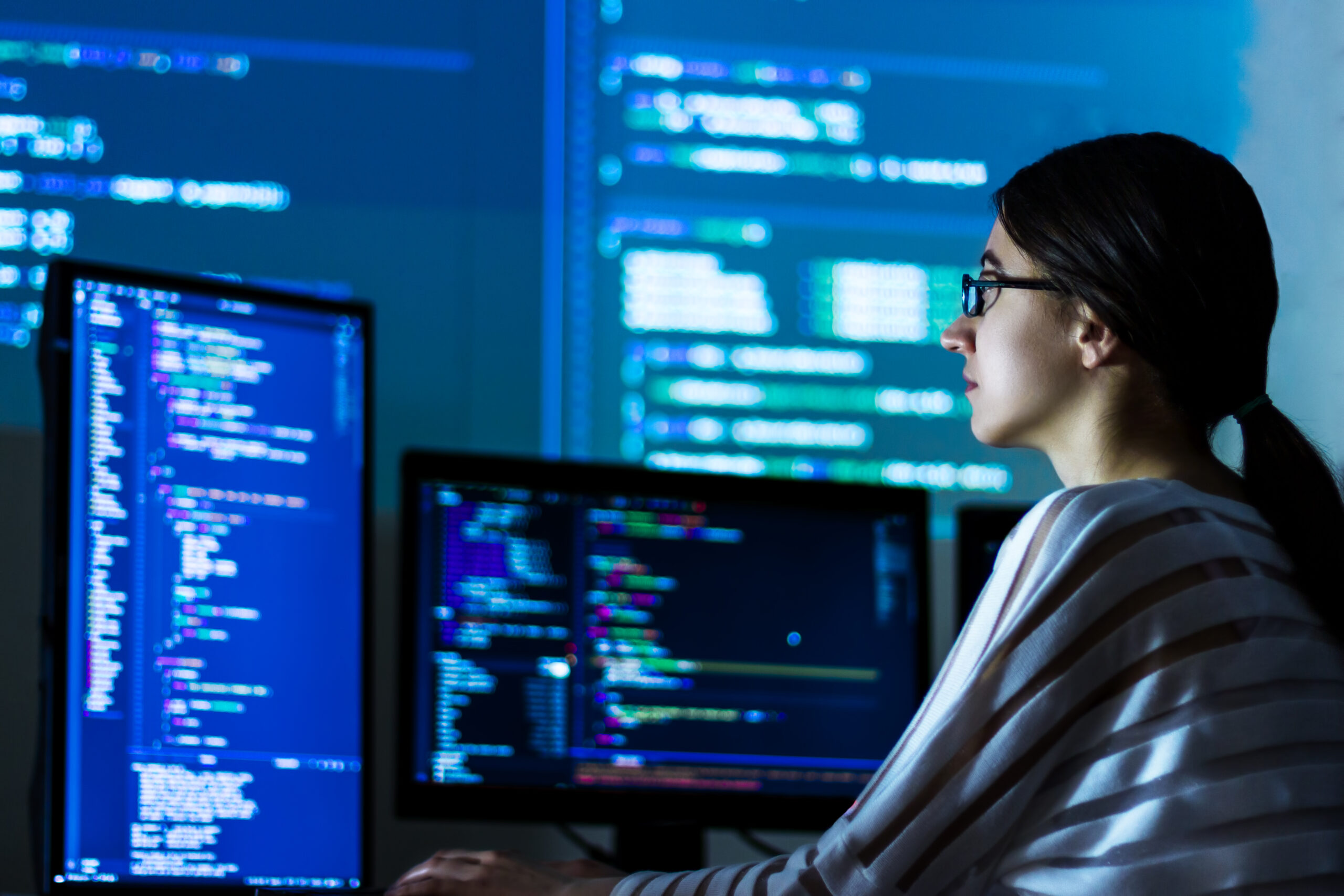 Software developer freelancer woman working at night